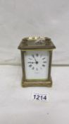 A brass carriage clock by Dyson & Son,