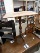 A Victorian tripod tip up side table