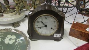 A Smith's bakelite mantel clock (working and with key attached)
