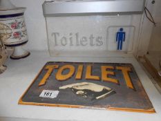 2 vintage toilet direction signs.