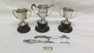 3 silver trophy cups with stands,