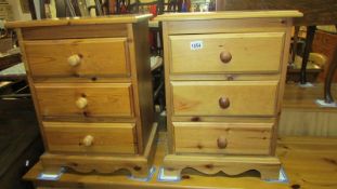 A pair of pine 3 drawer bedside cabinets