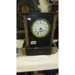 A black marble mantel clock, case loose,