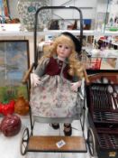 Porcelain collectors doll in 1940's dolls pushchair