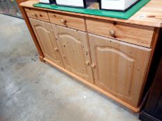 A pine 3 drawer 3 cupboard kitchen unit