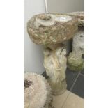 A vintage 3 Graces bird bath