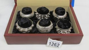 A cased set of 6 unusual napkin rings marked Oman 925