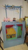 A string puppet theatre The 3 Little Pigs