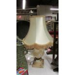 A large heavy carved pink alabaster table lamp