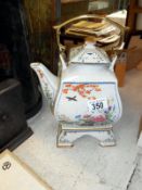 A Japanese collectors tea pot on stand