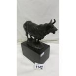 A bronze bull sculpture on marble base signed Milo and with foundry stamp