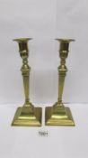 A pair of brass candlesticks