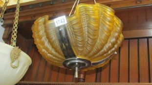 A Art Deco amber glass clam shell ceiling light