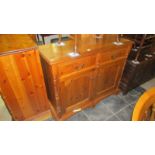 A soild pine 2 drawer 2 door cupboard