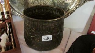A bronze jardiniere decorated with animals and figures