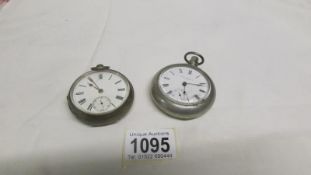 A silver pocket watch and an American pocket watch
