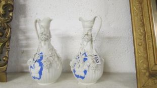 A pair of salt glazed 'Baccanalia' jugs,