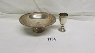 A silver dish and a small silver trophy,