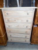 A solid pine 6 drawer chest of drawers