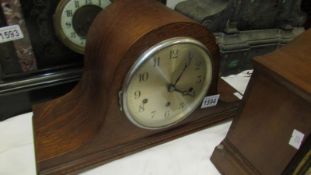 A 1930's oak Westminster chime Napoleon hat mantel clock