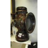 An early 20th century Belsize King of the Road car lamp (handle missing and crack to glass)