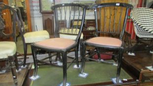 A pair of ebony chairs