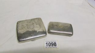 2 silver cigarette cases hall marked Birmingham 1987/98 and 1915/16, approx.