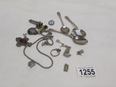 A bag of mainly silver items including spoons,