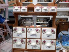 A pine rack with glazed pottery spice drawers (1 drawer a/f)