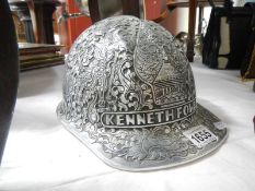 A decorated safety helmet believed to have been awarded to Long serving miner's in Indonesia