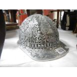A decorated safety helmet believed to have been awarded to Long serving miner's in Indonesia