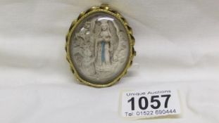 An 'Our Lady of Knock' 19th century brass finial plaque