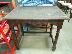 A carved oak side table