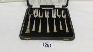 A cased set of silver cake forks