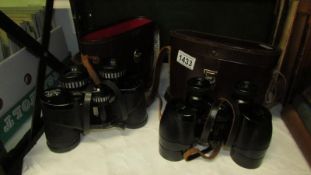 2 pairs of leather cased binoculars,