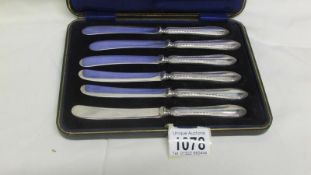 A cased set of 6 silver handled butter knives