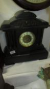 An Edwardian paladian style black slade mantel clock