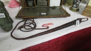 A leather horse whip