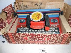 A boxed Mettoy Mettype portable typewriter