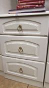 A pair of white 3 drawer bedside chests