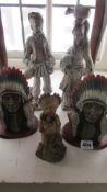 A pair of figures and 3 American Indian figures