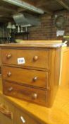 A miniature 3 drawer mahogany chest