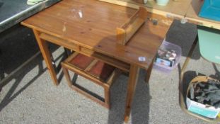 A pine table (missing drawers) and a tile top table