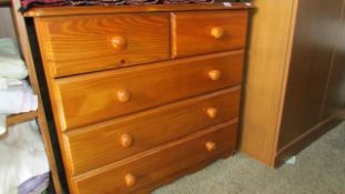 A pine 2 over 3 chest of drawers