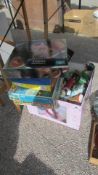 A box of dolls and a quantity of jigsaw puzzles