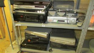 2 shelves of DVD and video players (sold as seen)