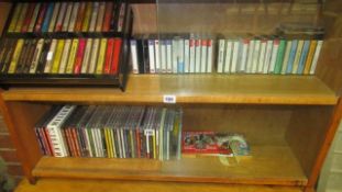 2 shelves of CD's and cassette tapes