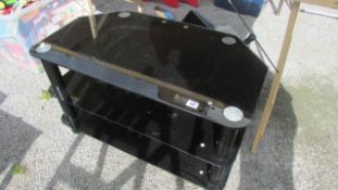 A black glass TV stand