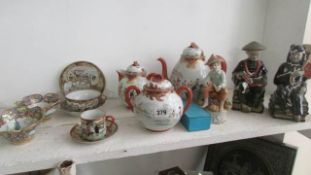 A mixed lot of oriental china and figures