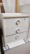 A white 3 drawer bedside chest